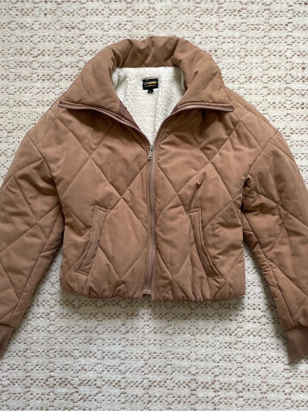 Tan quilted bomber jacket